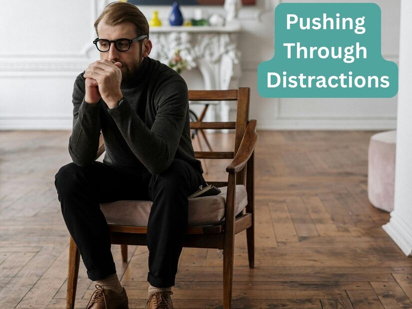 Man sitting thoughtfully in a quiet room, symbolizing the mental effort required to push through distractions during a 1 hour timer focus session.