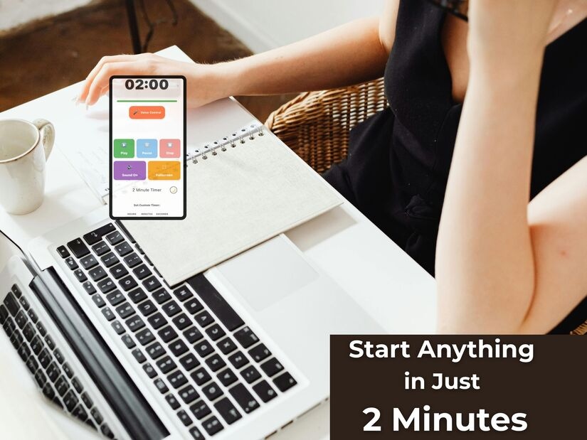 Person discovering what you can do in 2 minutes at laptop with timer on phone, coffee cup and notebook ready for micro-task