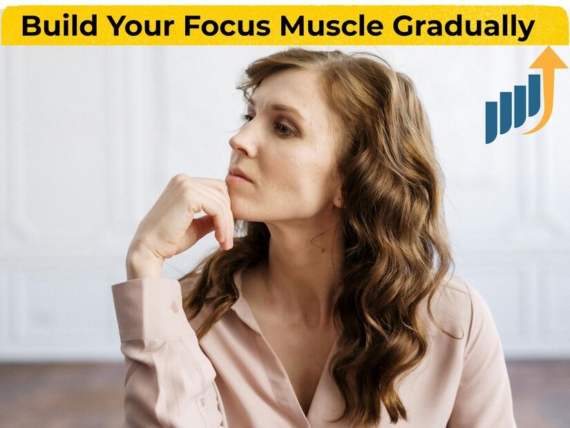 Woman with growth chart showing gradual progression in building Pomodoro focus capacity