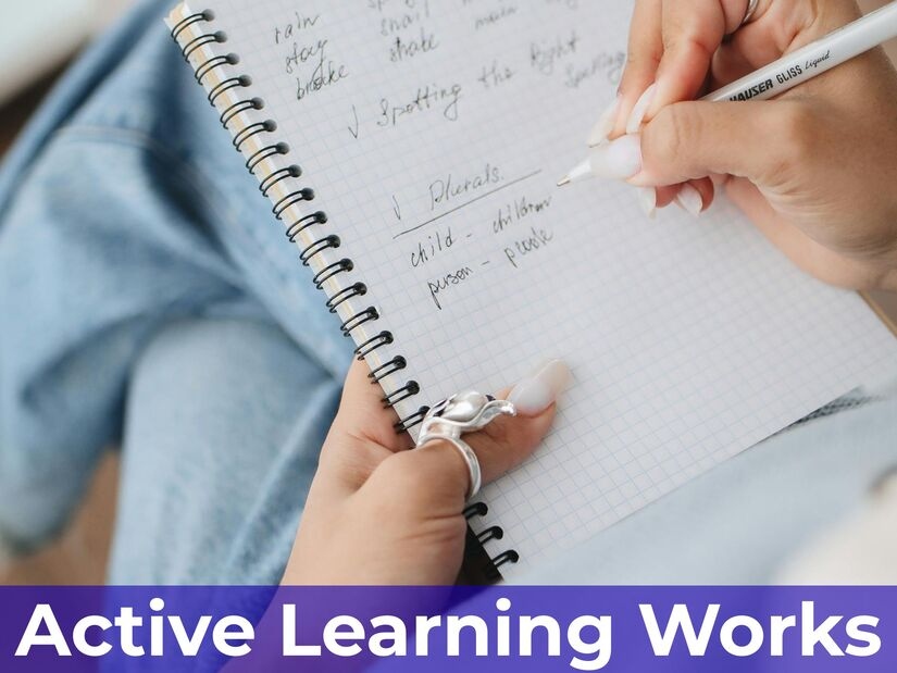 Student's hands creating a colourful mind map study diagram with connected concepts and visual learning materials on the desk