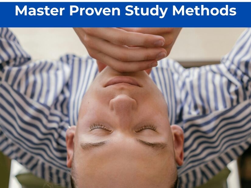 Confident student looking satisfied at an organised study desk after completing a productive learning session with visible study materials
