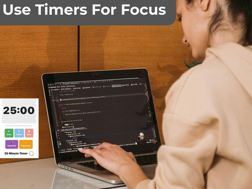 A Professional using deep work techniques with a timer for a focused concentration session on a laptop workspace
