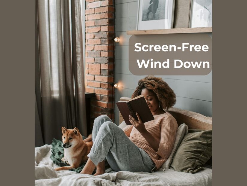 Woman reading physical book in bed as evening routine idea showing screen-free wind-down for better sleep quality
