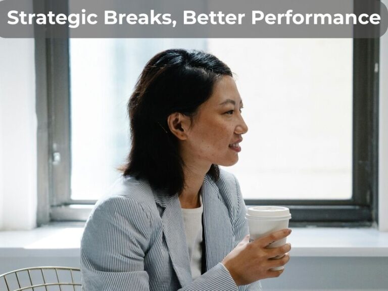 Office worker on break by window showing how long should work breaks be for optimal productivity