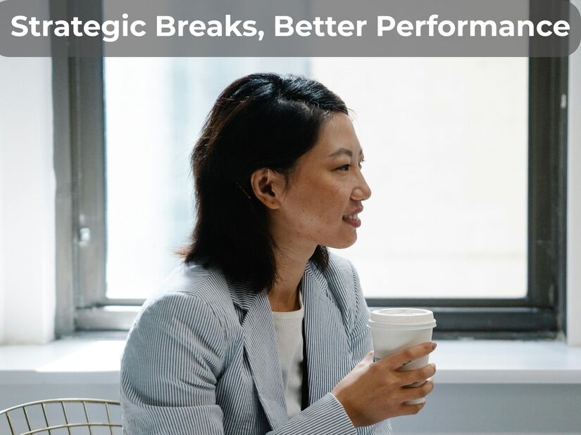Office worker on break by window showing how long should work breaks be for optimal productivity