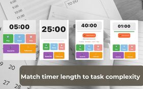 Overhead view of a laptop displaying a color-coded Daily Schedule With Timers next to a physical notebook.