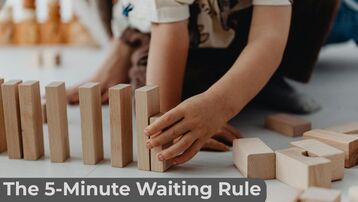 A work from home parent schedule strategy showing a child playing with blocks during the 5-Minute Waiting Rule.