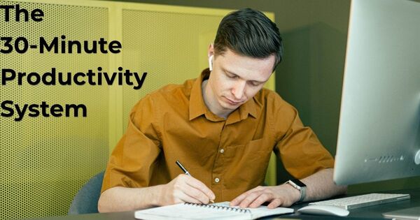 A person focusing on deep work and taking notes during a 30 minute timer productivity sprint