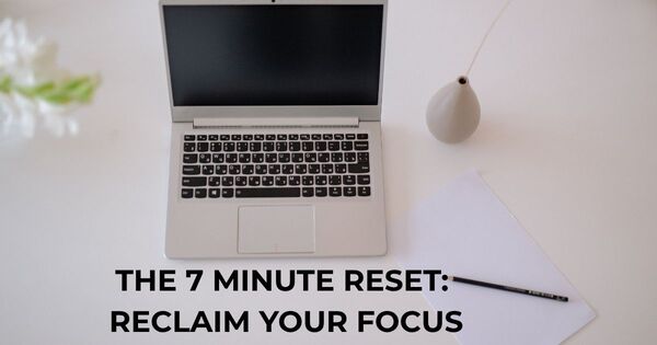 Person using a 7 minute timer on a clean desk for scientific focus reset and cognitive throughput.