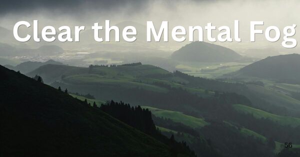 A landscape view of rolling hills under a dramatic, misty sky, representing the concept of mental clarity and cognitive transition during a workflow reset.