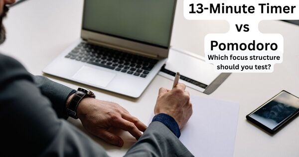 Person writing at a desk while comparing a 13-minute timer with Pomodoro