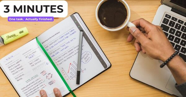 Open notebook, highlighters and coffee on a wooden desk showing what you can do in 3 minutes